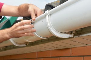 Beaverton Gutter Repair being done by worker